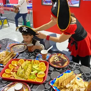 Colourful birthday party table with cake, balloons, and decorations at Flipz Academy Birthday party Gold Coast